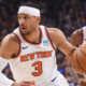 Josh Hart dribbling basketball during NBA game with New York Knicks teammate running behind on court action scene
