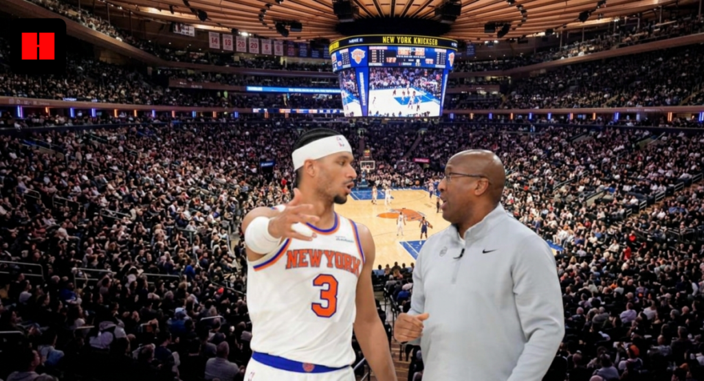 Josh Hart of the New York Knicks having an intense sideline discussion with an assistant coach during a game at Madison Square Garden.