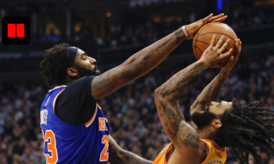 New York Knicks player blocks a Phoenix Suns player during an intense NBA game action shot near the basket