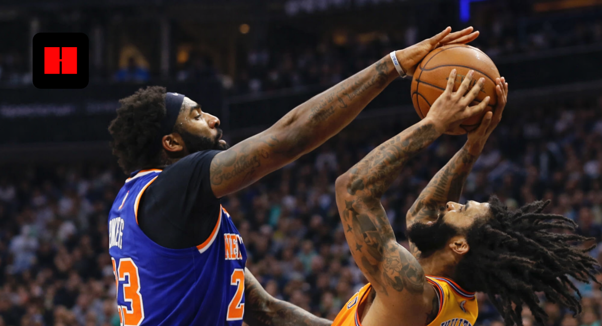 New York Knicks player blocks a Phoenix Suns player during an intense NBA game action shot near the basket