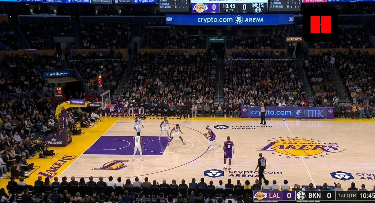 Wide shot of Lakers vs Nets game at Crypto.com Arena with Los Angeles on offense and Brooklyn set on defense during first quarter action.