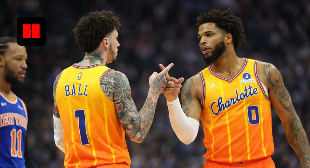 LaMelo Ball and Miles Bridges of Charlotte Hornets celebrating with handshake during NBA game action