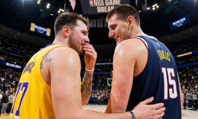Luka Dončić and Nikola Jokić share a postgame moment on court during an NBA game break