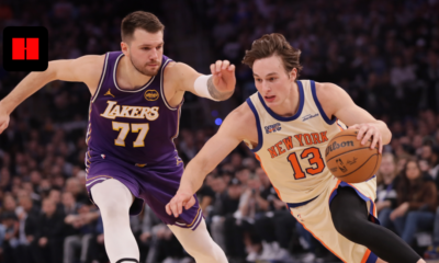 Luka Doncic driving past New York Knicks defender during NBA game action on court