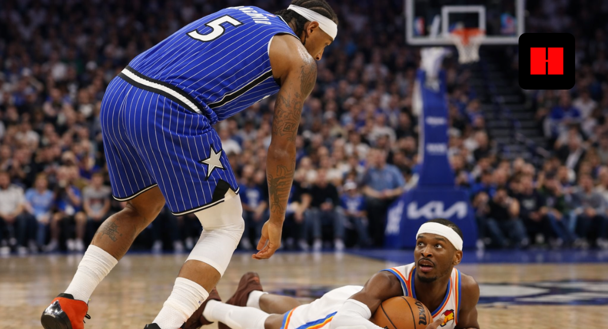 Orlando Magic guard Markelle Fultz defends as Oklahoma City Thunder's Shai Gilgeous-Alexander dives for a loose ball during an NBA game