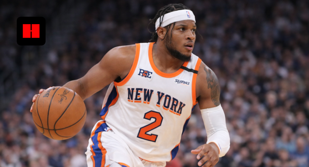 Miles McBride dribbling the basketball for the New York Knicks during an NBA game