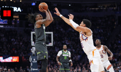 NBA player taking a jump shot while New York Knicks defender contests the shot during live basketball game