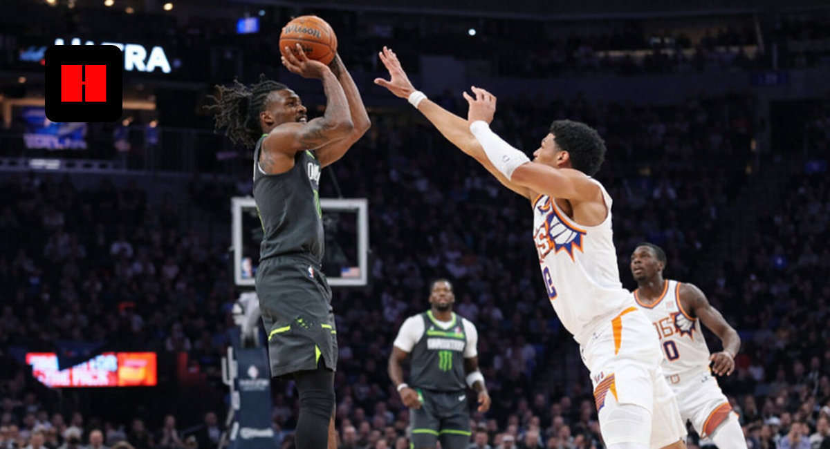 NBA player taking a jump shot while New York Knicks defender contests the shot during live basketball game