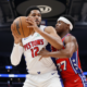 Detroit Pistons center posts up against a Philadelphia 76ers defender during the Pistons beat 76ers 131-109 game at Little Caesars Arena.