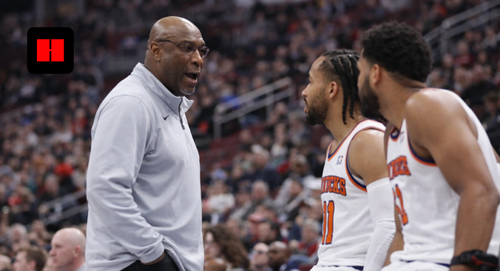 New York Knicks coach giving instructions to players on the bench during NBA game sideline moment