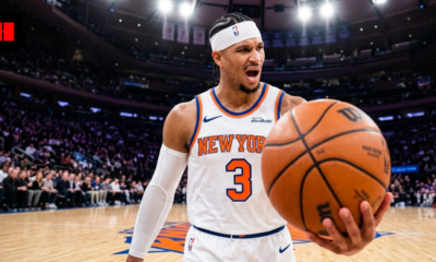 New York Knicks player Josh Hart in a white home jersey and headband, showing intense emotion during a game at MSG.
