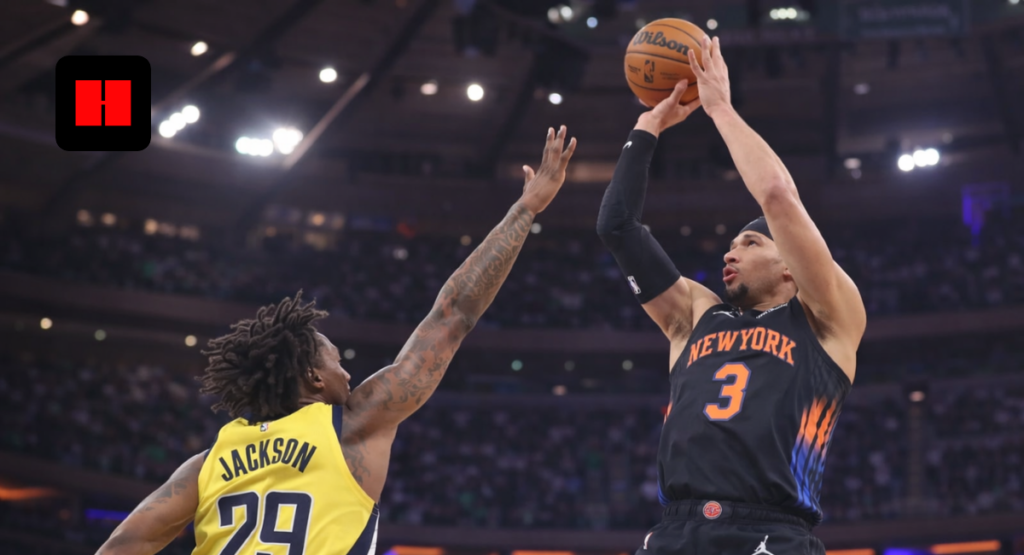 New York Knicks player attempting jump shot against Indiana Pacers defender in low angle basketball game action