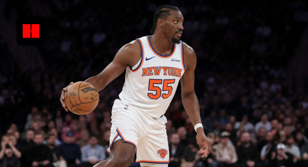 New York Knicks player number 55 dribbling the basketball during an NBA game action shot