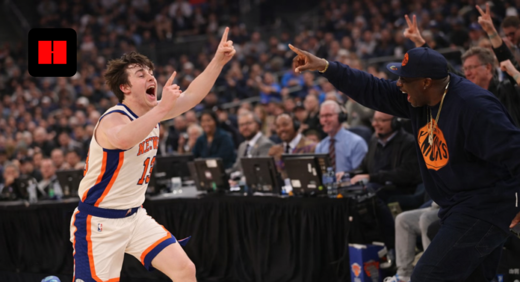 New York Knicks player celebrating near courtside with excited fan reacting during NBA game