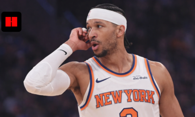 New York Knicks basketball player wearing white headband dribbling ball during NBA game action