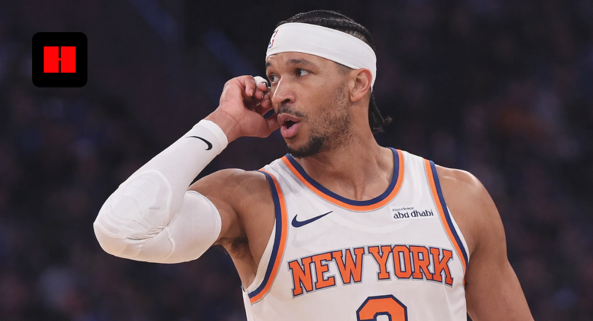 New York Knicks basketball player wearing white headband dribbling ball during NBA game action