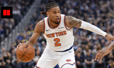 New York Knicks player dribbling past Golden State Warriors defender during NBA game action