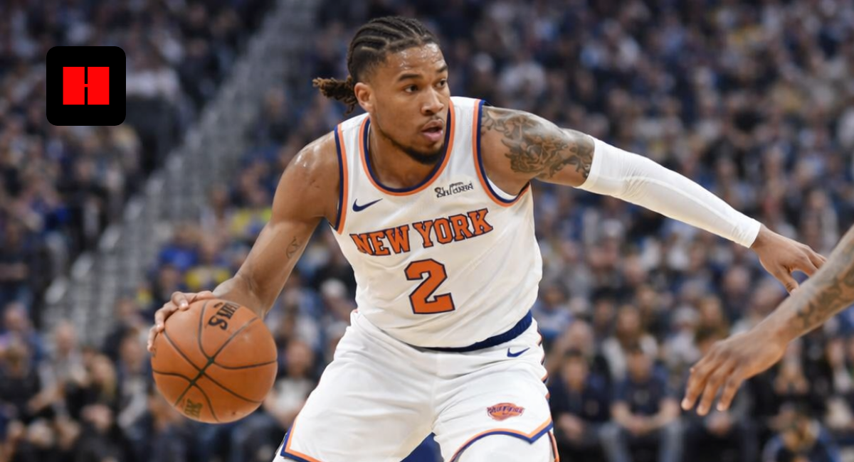 New York Knicks player dribbling past Golden State Warriors defender during NBA game action