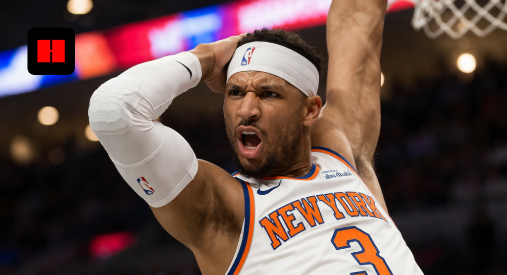 New York Knicks player performing a powerful dunk during an NBA basketball game in an indoor arena