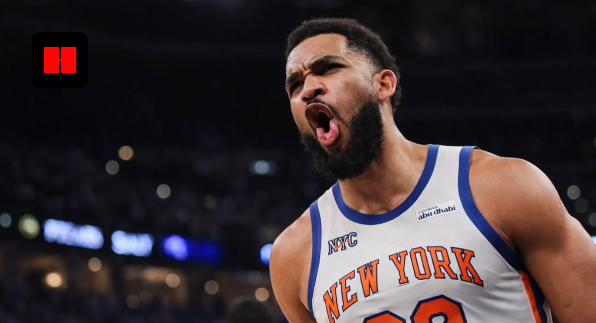 New York Knicks basketball player showing intense reaction during an NBA game with crowd and arena lights in the background
