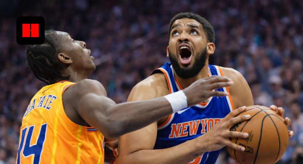New York Knicks player driving to the basket while defended by Charlotte Hornets player during an NBA game