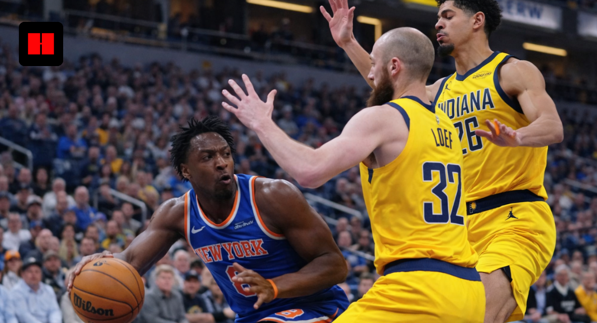 New York Knicks player driving to the basket while Indiana Pacers defenders attempt to block during an NBA game
