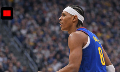 New York basketball player driving with the ball while defended by New Orleans Pelicans player during an NBA game