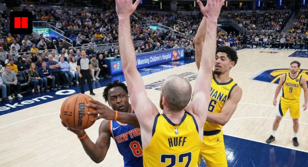 New York Knicks forward OG Anunoby drives to the basket against Indiana Pacers center Jay Huff and teammate during a high-energy NBA game at Gainbridge Fieldhouse.