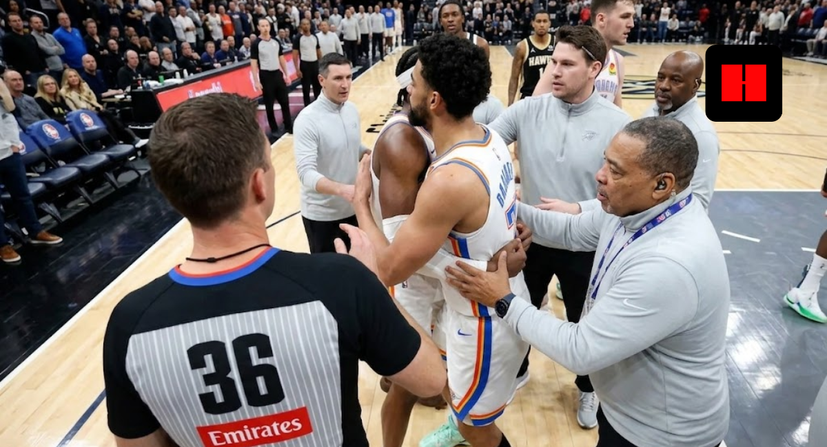 Oklahoma City Thunder's Chet Holmgren and Shai Gilgeous-Alexander being held back by officials and coaches during an intense NBA game moment.