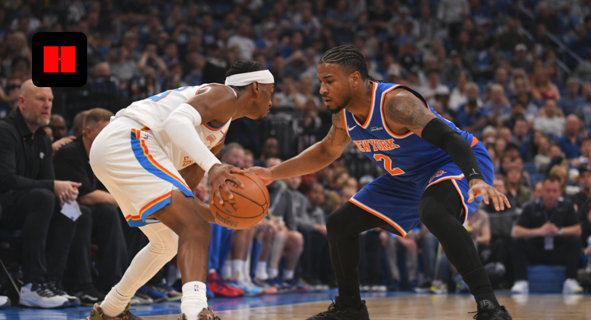 Oklahoma City Thunder player dribbling against New York Knicks defender during an NBA basketball game