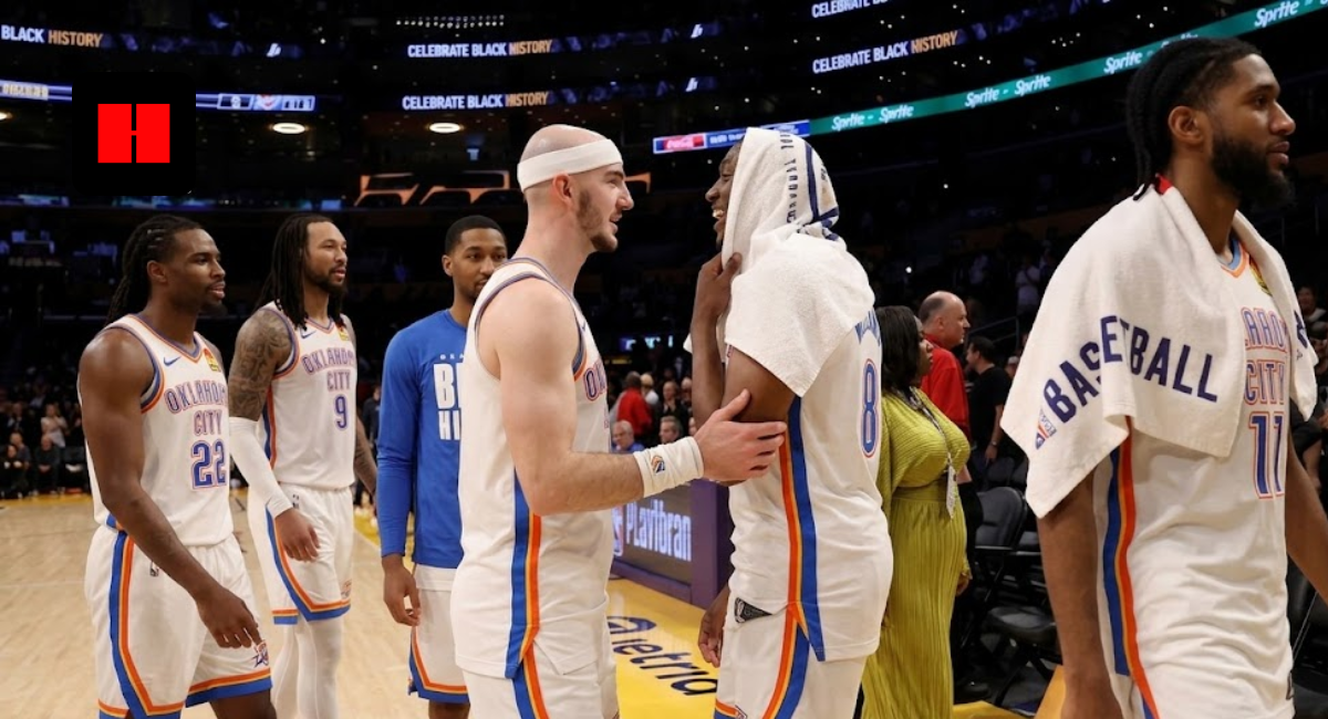 Oklahoma City Thunder players, including Alex Caruso and Jalen Williams, laughing on the court during a Celebrate Black History game night.
