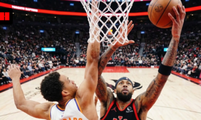 Phoenix Suns Oso Ighodaro defending a layup by a Toronto Raptors player during an NBA game at Scotiabank Arena.