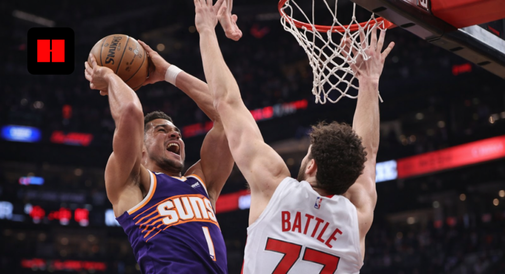 Phoenix Suns player dunking over defender during NBA game action in UHD arena shot