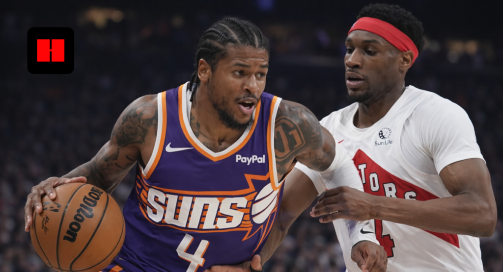 Phoenix Suns guard drives to the basket against a Toronto Raptors defender during an NBA game, showcasing close defensive pressure and in-game intensity in UHD.