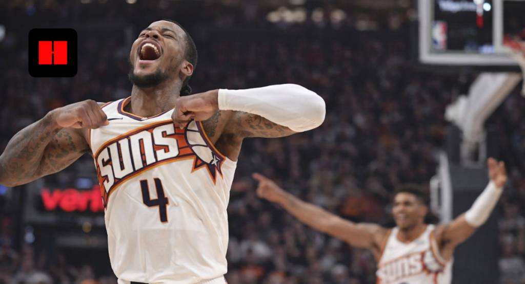 Phoenix Suns player celebrating passionately during an NBA basketball game with teammate in background