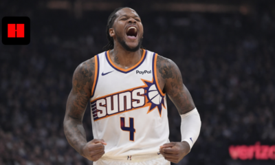 Phoenix Suns player celebrating passionately during an NBA game in a white home jersey