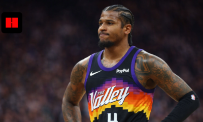 Phoenix Suns player wearing The Valley jersey standing confidently on the court during an NBA game in high resolution.