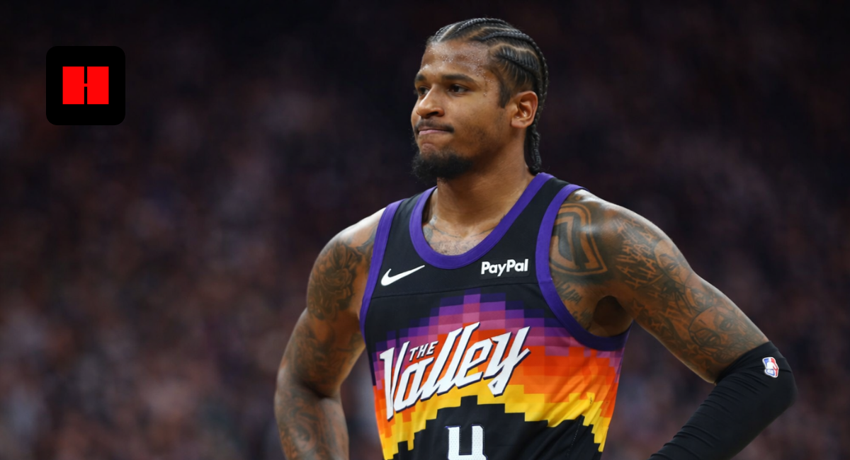 Phoenix Suns player wearing The Valley jersey standing confidently on the court during an NBA game in high resolution.
