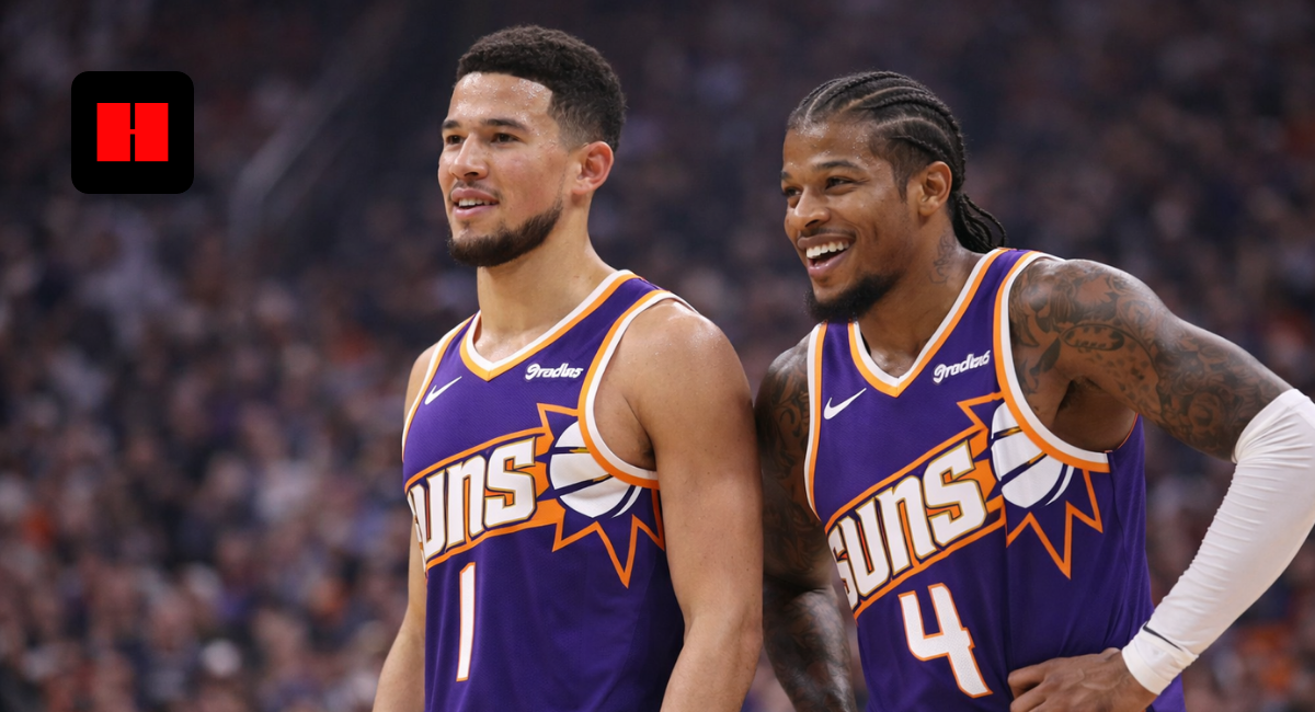 "Phoenix Suns basketball players standing on court during game in UHD quality, wearing purple jerseys with crowd background"