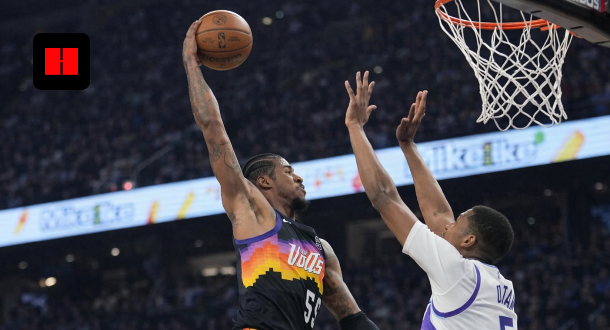 Phoenix Suns player attempting a layup over Utah Jazz defender during an NBA game action shot
