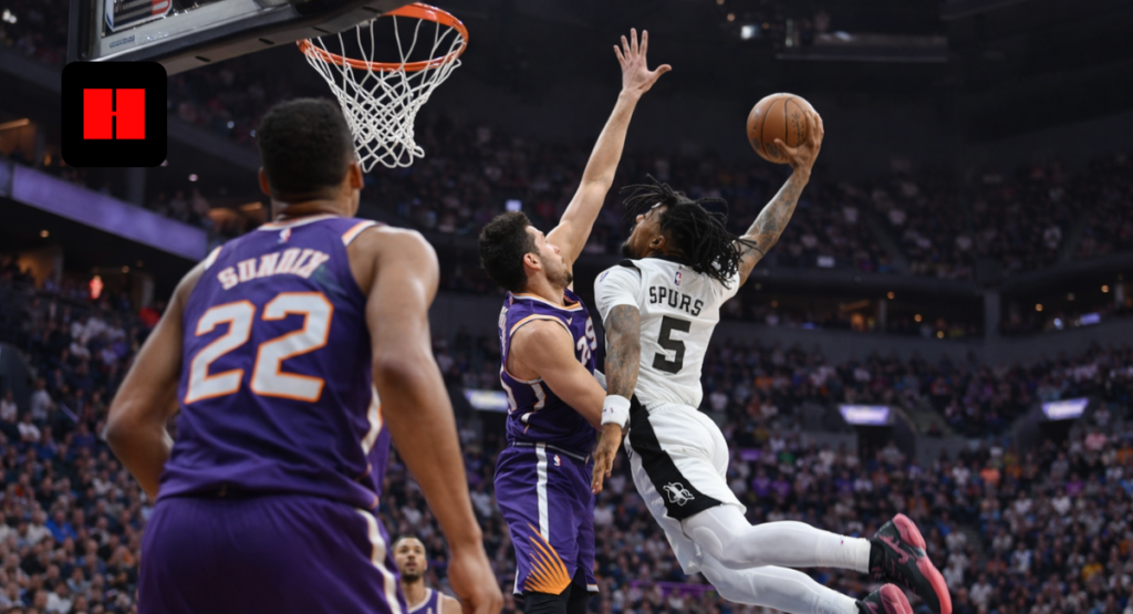 San Antonio Spurs player attempting a high-flying layup against Phoenix Suns defenders during an intense NBA game.