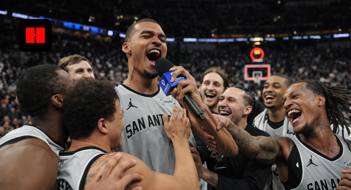 San Antonio Spurs players celebrating together during emotional post-game interview with microphone in packed NBA arena captured from unique camera angle