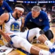 Seth Curry reacts in pain during Golden State Warriors game after suffering adductor soreness against the Minnesota Timberwolves.