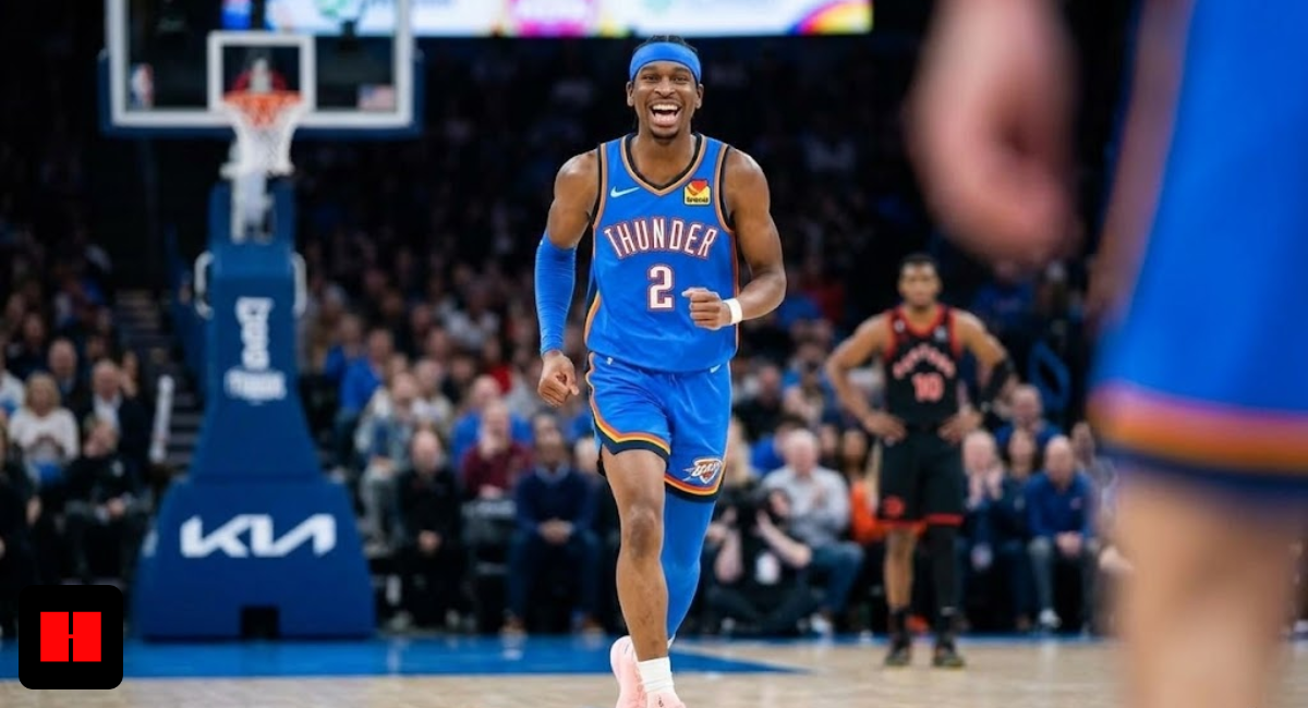 Shai Gilgeous-Alexander wearing a blue Oklahoma City Thunder jersey celebrating on the basketball court during an NBA game.
