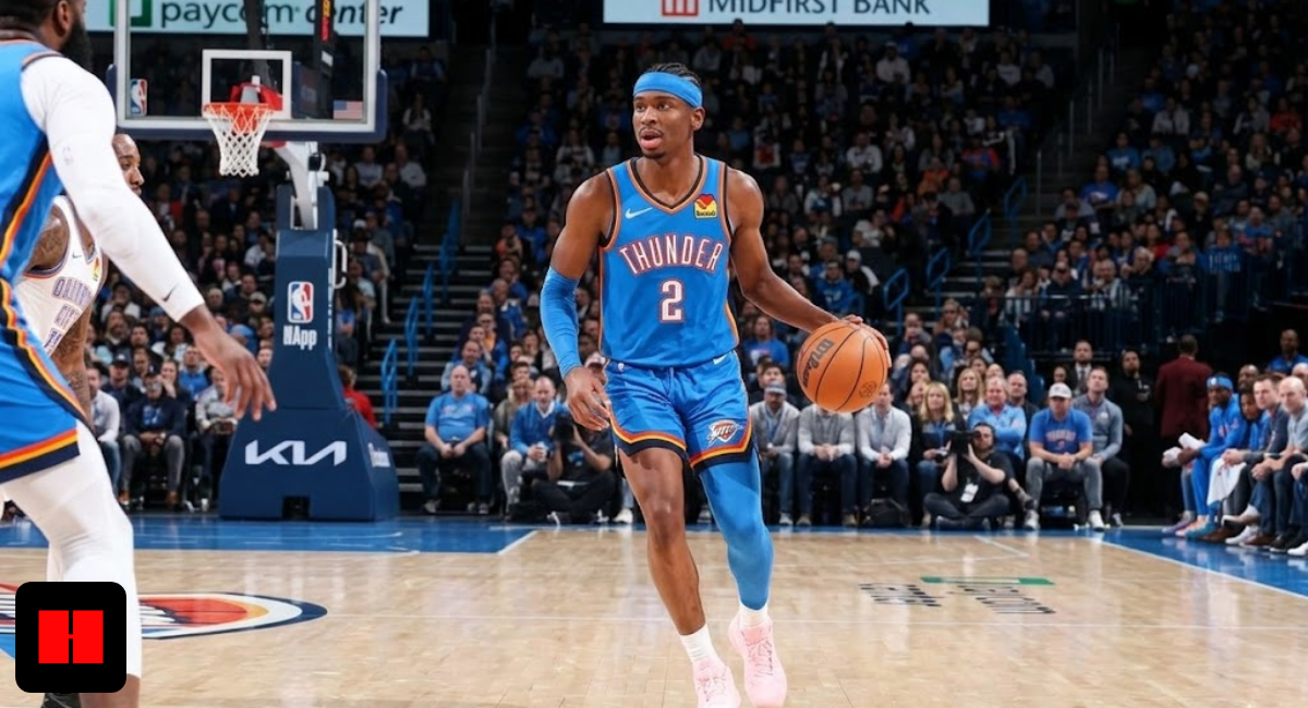 Shai Gilgeous-Alexander of the Oklahoma City Thunder dribbling a basketball during an NBA game, wearing a blue jersey and pink sneakers.