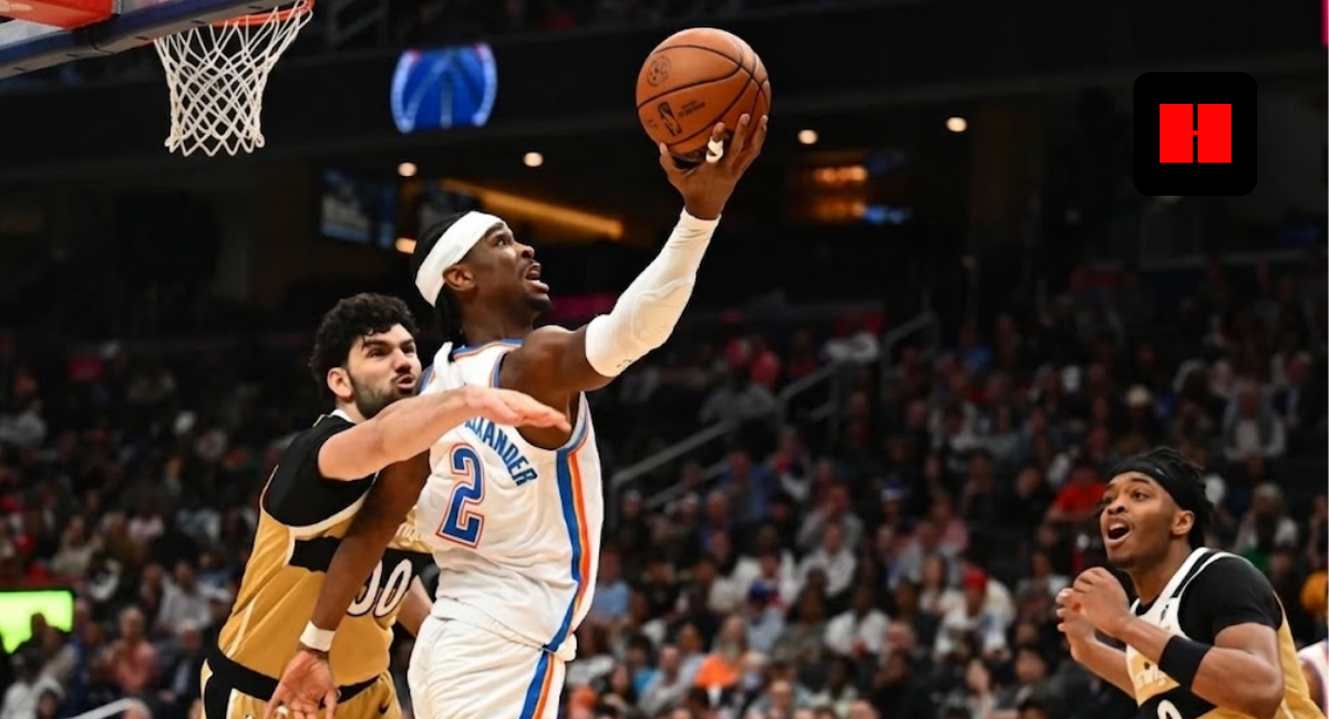 Shai Gilgeous-Alexander of the Oklahoma City Thunder driving for a layup against the Washington Wizards defense in a crowded NBA arena.