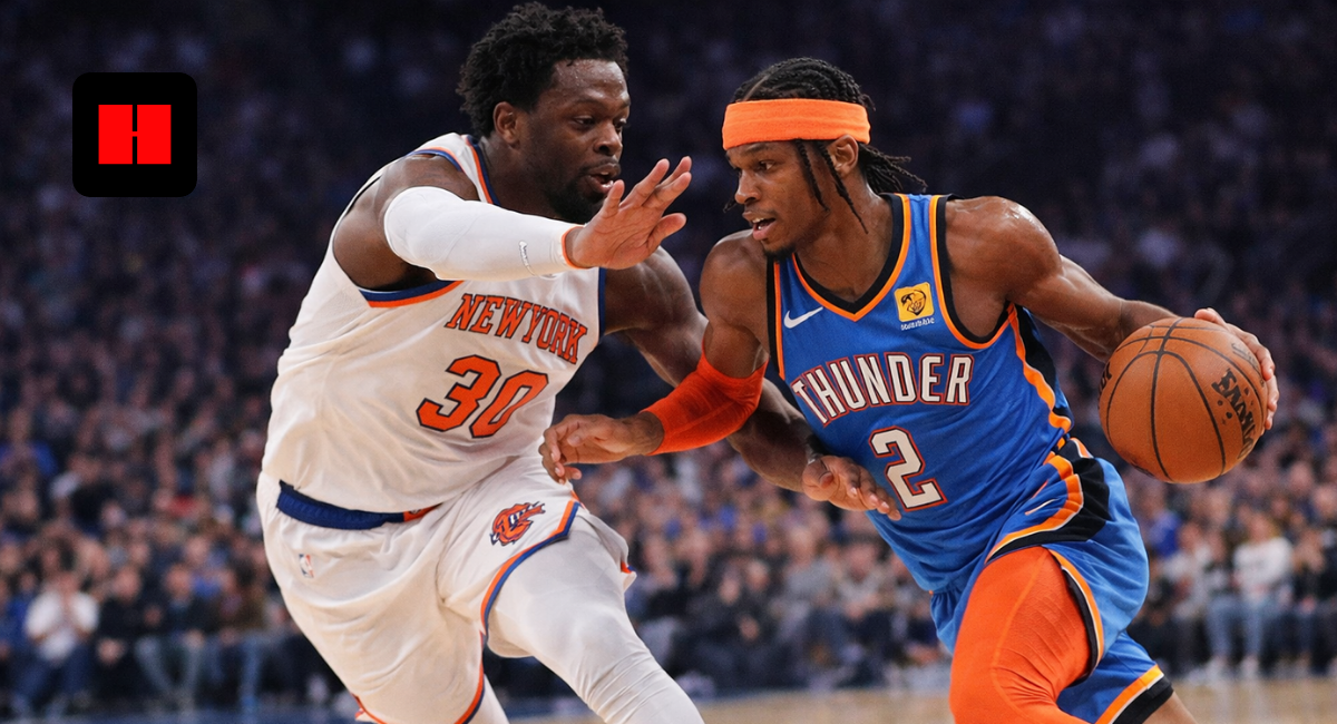 Shai Gilgeous-Alexander dribbling past Julius Randle during an NBA game with intense defense and action moment