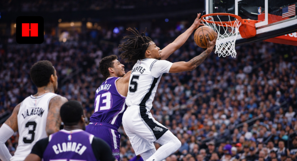 San Antonio Spurs guard soars for acrobatic layup over Sacramento Kings defender in high-flying NBA in-game action