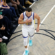 Stephen Curry walking off the court during a Golden State Warriors game amid injury absence in 2026