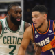Phoenix Suns guard Devin Booker driving the ball against Boston Celtics forward Jaylen Brown in an NBA game.
